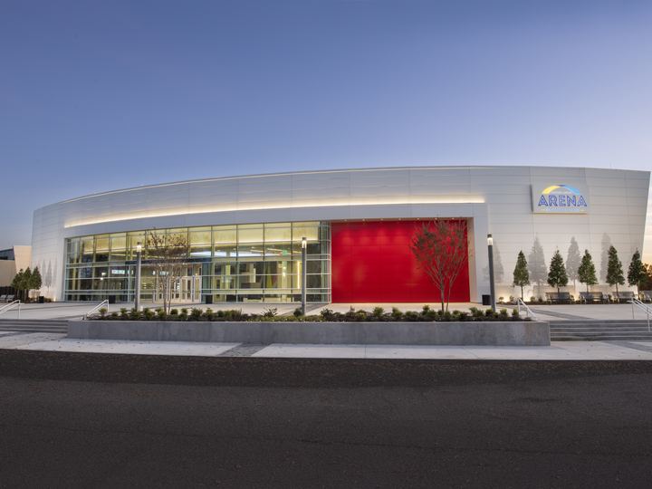 Modern exterior of Gateway Center Arena in College Park at twilight