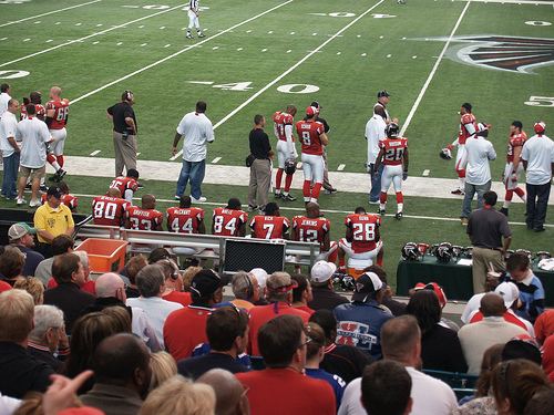Falcons players on the sideline at the Georgia Dome during a game against the Giants