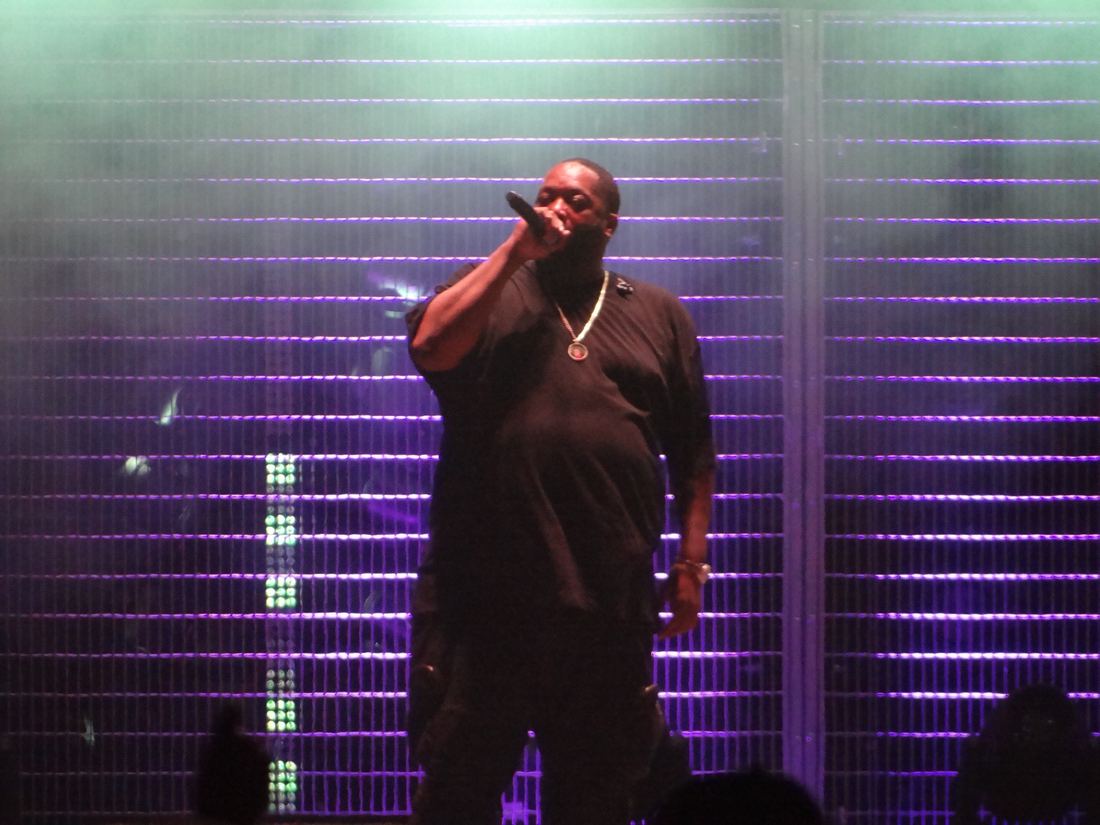Killer Mike rapping under purple stage lights at Shaky Knees in Atlanta