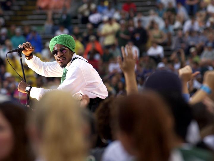 André 3000 of OutKast performing for a festival crowd in 2003