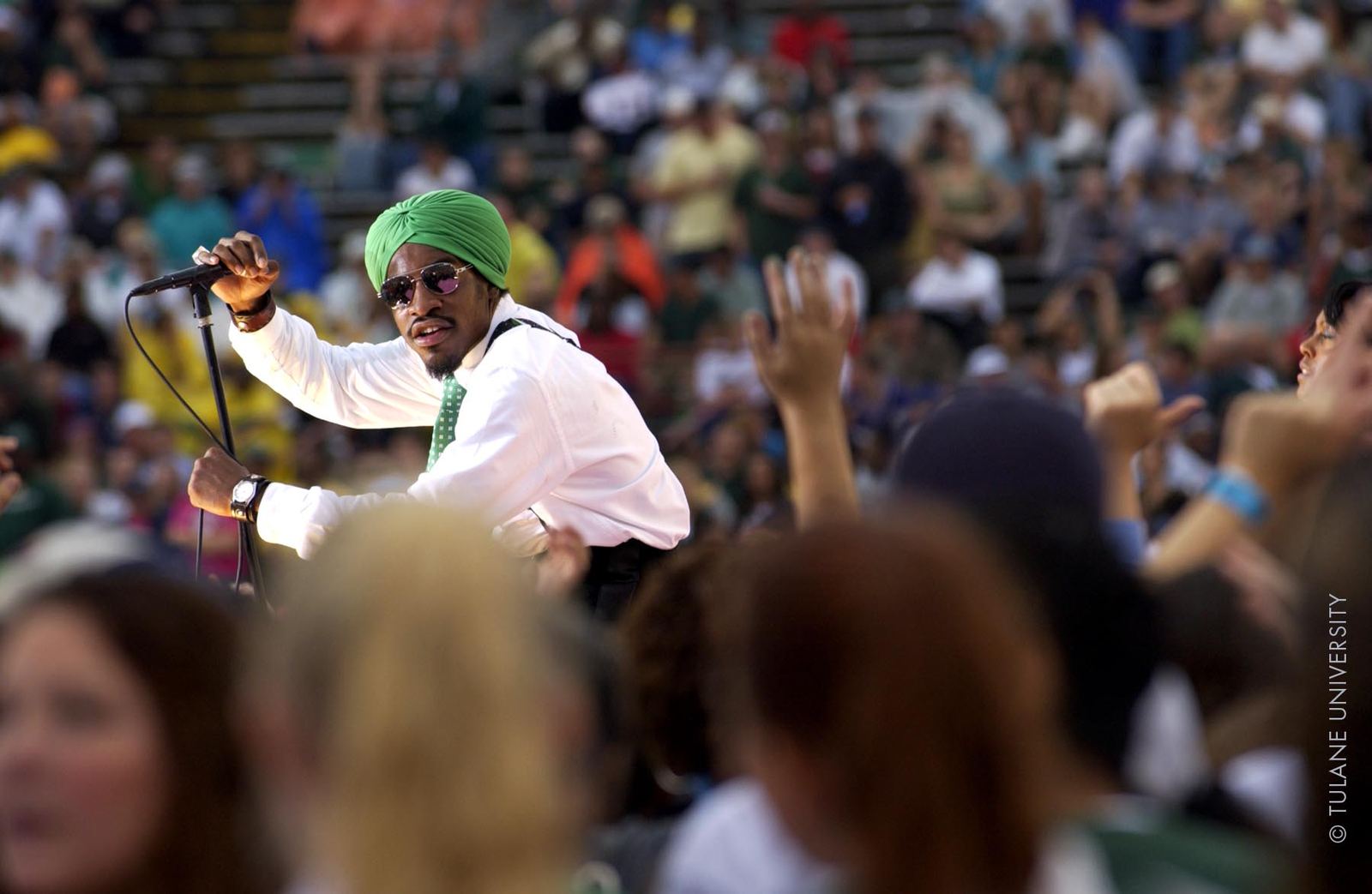 André 3000 of OutKast performing for a festival crowd in 2003
